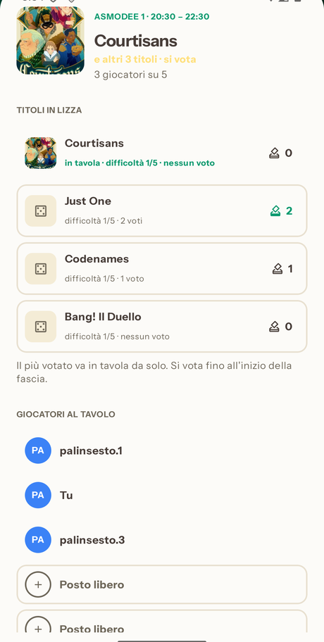 La stessa fascia nell'app: il gioco in tavola, la riga «e altri 3 titoli · si vota», i titoli in lizza con i voti presi e la frase «Il più votato va in tavola da solo»